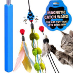 A cat toy set featuring a blue magnetic catch wand with dangling feather and pom-pom accessories, shown alongside a gray tabby cat reaching for the toy. A blue product badge reads 'MAGNETIC CATCH WAND' and 'THE CAT TOY THAT LETS THEM WIN.